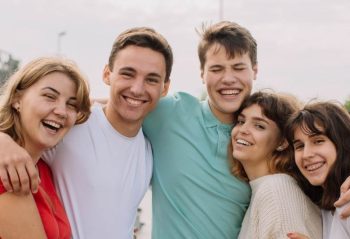 Summer holidays and teenage concept - group of smiling teenagers